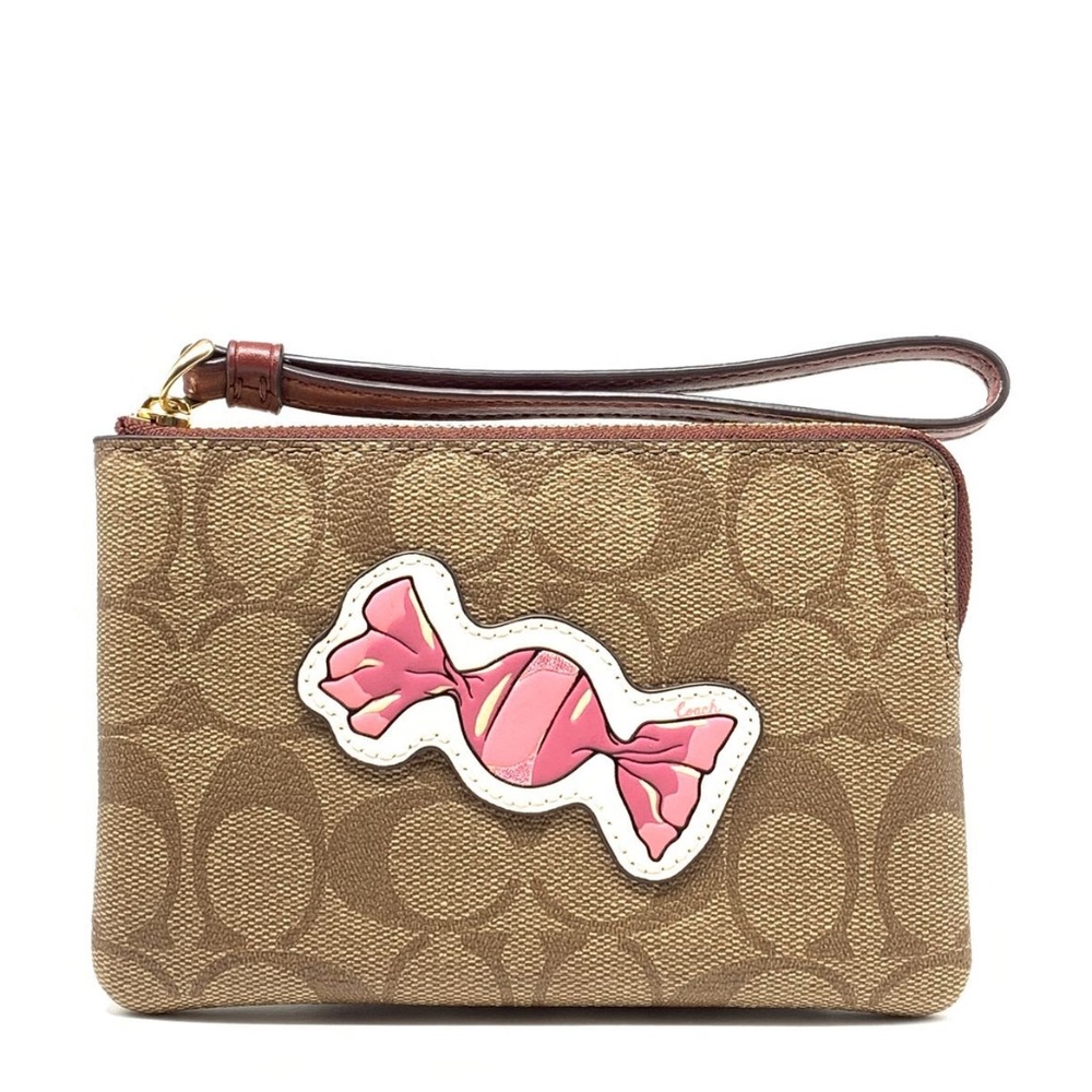 Coach corner zip wristlet in signature canvas with motif